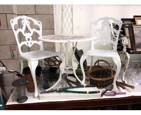 A cast aluminium garden table and 2 chairs