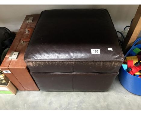 A square leather foot stool/pouffe