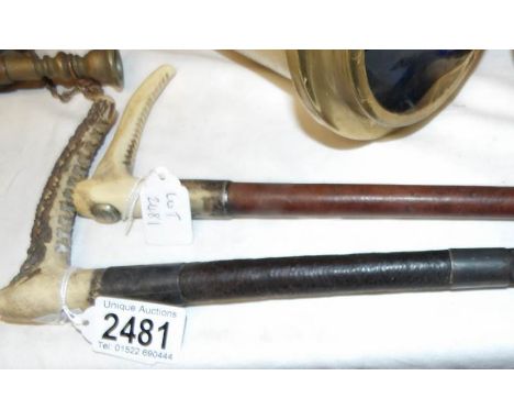A Wilkinson Saddlery, Grantham riding crop and a silver banded riding crop.