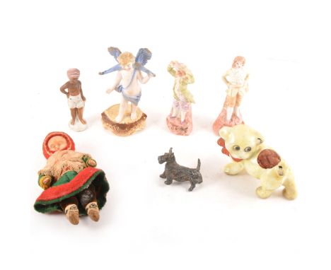 A collection of small bisque figures and miniature doll figures, early plastic animals.