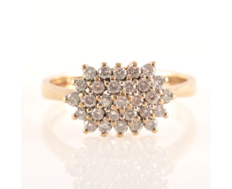 A diamond cluster ring, twenty-nine briliant cut stones claw set in a 9 carat yellow gold boat shape mount, ring size P.