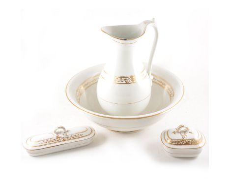 A Staffordshire four-piece toilet set, gilt decoration, comprising a ewer, 38cm, basin, soap dish, and toothbrush dish.