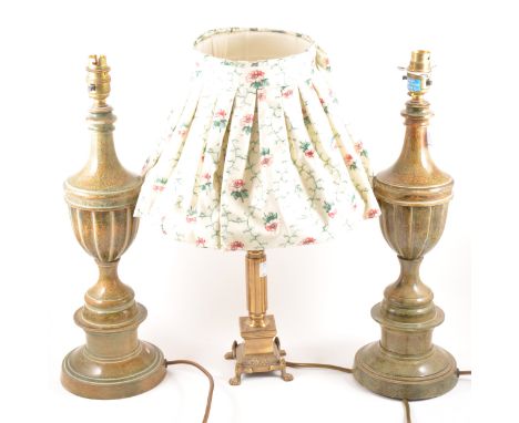 A pair of simulated marble table lamps, urn form, raised on socles, 46cm, and a cast brass table lamp, 30cm inc. fittings.