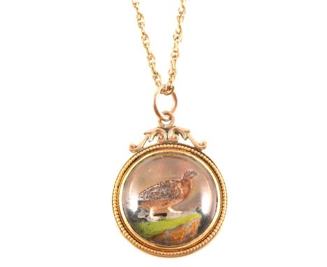 A game bird pendant and chain, the circular crystal pendant painted with a game bird and having a 21mm rose metal solid back 