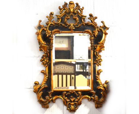 A reproduction parcel gilt pier glass, shaped rectangular bevelled plate, 81cm x 57cm.