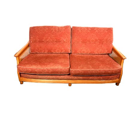 Ercol ash framed bergere style three-piece suite, cane panelled sides, loose cushions, comprising a sofa, length 190cm and a 