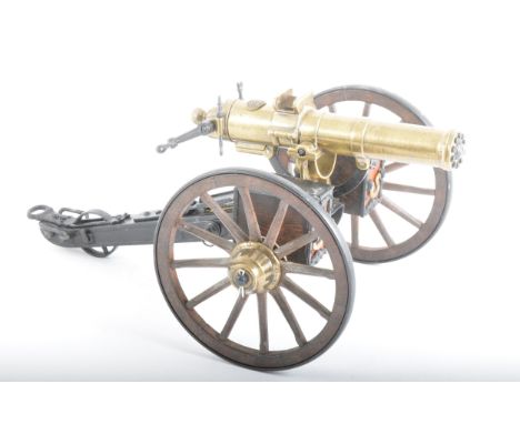 A detailed model of a desk top Gatling field gun modelled by Hartford Conn, brass ten barrel, applied plaque "Gatling USA 188