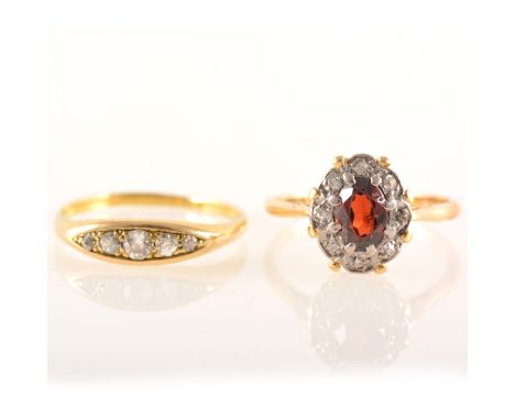Two yellow metal gemset rings, a yellow metal boat shape mount set with five old cut diamonds graduating in size, approximate