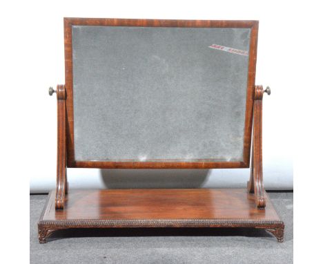 A Victorian mahogany toilet mirror, adjustable rectangular plate, on scrolled supports, beaded plinth, width 74cm, and anothe