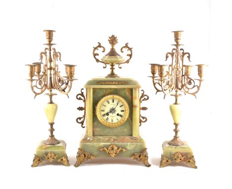 French onyx and gilt metal three-piece clock garniture, ivorine dial, signed Le Goupy, Paris, movement by S Marti &amp; Cie, 