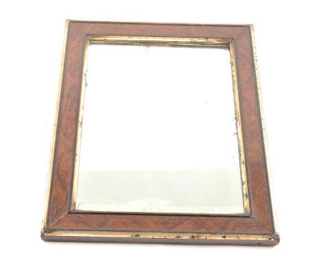 Small simulated walnut and parcel gilt wall mirror, rectangular bevelled plate, 36cm x 28cm.