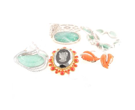 Five items of vintage simulated jade jewellery, a seven panel necklace with chain back, sautoir with an art deco style pendan