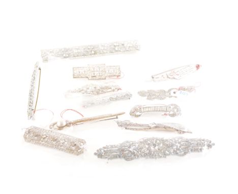 Twelve vintage paste set bar brooches, mostly 1930's Czechoslovakia, set with brilliants and baguettes, 45mm to 100mm.