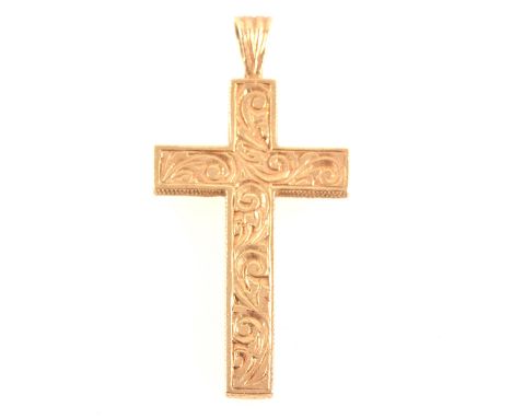 A 9 carat yellow gold cross and chain, the 35mm x 20mm cross having an engraved pattern to front and textured back hallmarked