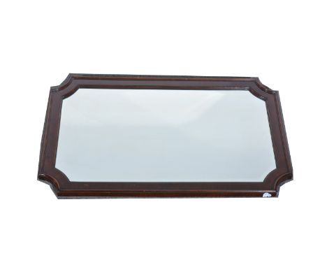 A mahogany framed wall mirror, rectangular bevelled plate with canted corners, moulded surround, 49cmx 79cm.