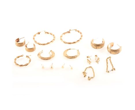 A collection of gold earrings for pierced ears, 9 carat yellow gold creole and wedding ring hoops, total weight approximately