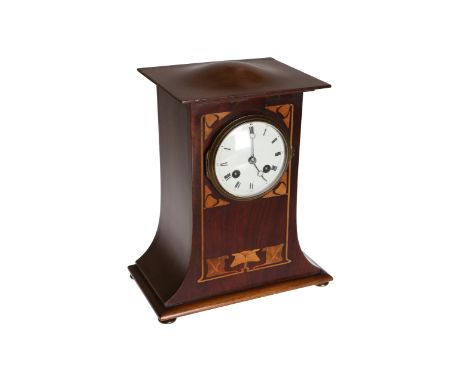 An Art Nouveau inlaid mahogany mantel clock, c.1905, the overhanging slightly domed canopy above a tapering case with stylise