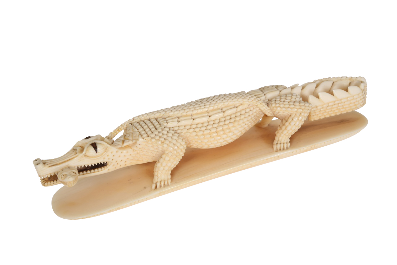 An African ivory carving of a crocodile, early 20th Century, carved