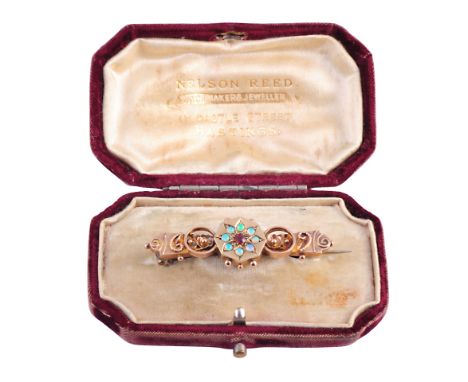 An opal, synthetic ruby and gold brooch, circa 1890, the octagonal mount with six beaded details set to the centre of a star 