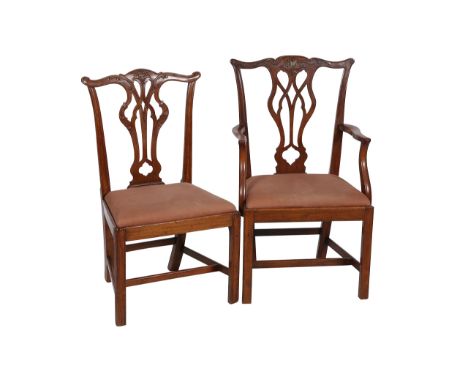 A matched set of eight Chippendale style mahogany dining chairs, including two carvers, each with yoked crest rail above a pi