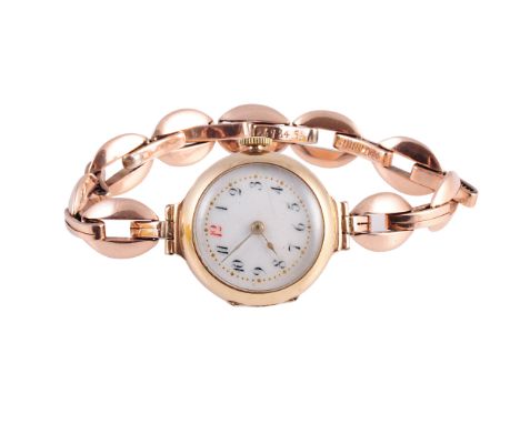 A lady's 9 carat gold case wristwatch, the circular white enamel dial with Arabic numerals, expanding bracelet strap.