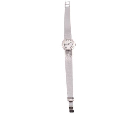 A lady's 9 carat white gold wristwatch, signed Jaeger-LeCoultre, the circular dial with Roman numerals and slight iridescence