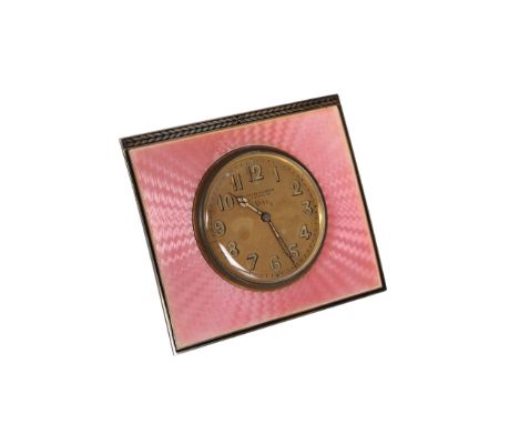 A Swiss pink enamel strut clock, early 20th Century, the rectangular engine turned face enclosing a dial, signed Frank Pochel