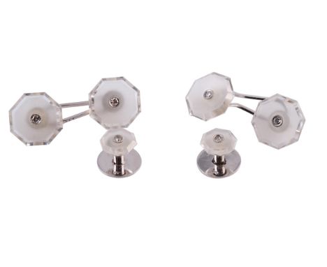 A pair of rock crystal and diamond cufflinks, circa 1910-15, each octagonal plaque of polished and un-polished rock crystal s