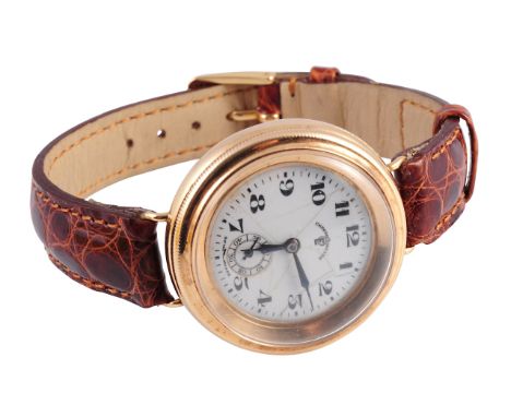 A Continental 14 carat gold gentleman's wristwatch, the screw off front revealing an inner hinged case, the white enamel dial