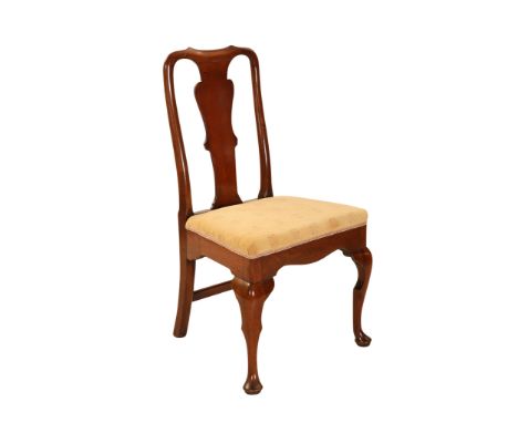 A fruitwood cabriole leg chair, first half of the 18th Century, with rounded uprights, the stuffed over seat above a front ra