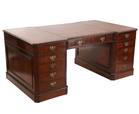 A handsome Chippendale Revival mahogany partner's desk, early 20th Century, the rectangular inverted breakfront top with cant