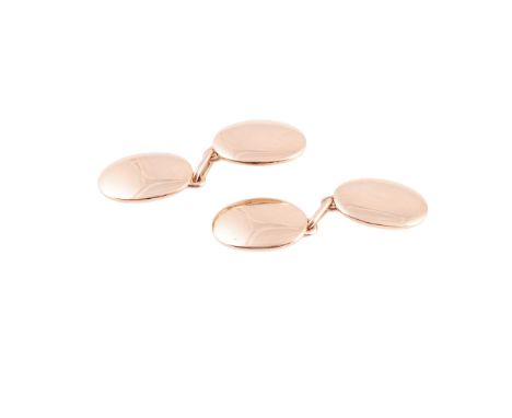 A pair of yellow gold cufflinks, of simple oval shaped plaques, each joined with an articulated chain of three oval shaped li