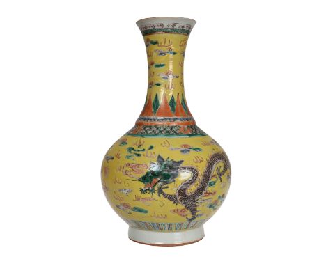 A Chinese Famille Jaune vase, the bulbous body issuing a trumpet neck, enamel painted with two four clawed dragons. 34.5cm