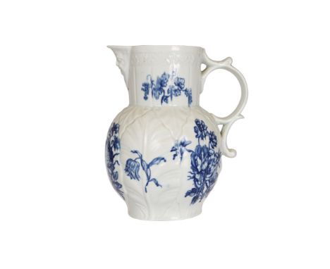 An English porcelain moulded cabbage leaf jug, the body decorated in underglaze blue with floral sprays and butterflies, with