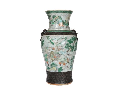 A Chinese crackle glazed vase, 19th/20th Century, of shouldered ovoid form with flared neck and moulded mask ring handles, en