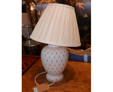 A large pink patterned ceramic table lamp, with a white pleated silk shade, H.45cm 