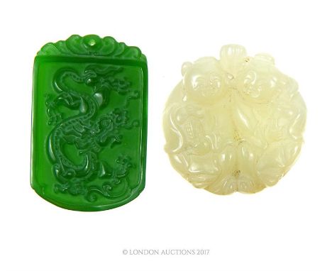 A Chinese white jade carving, together with a spinach jade pendant.