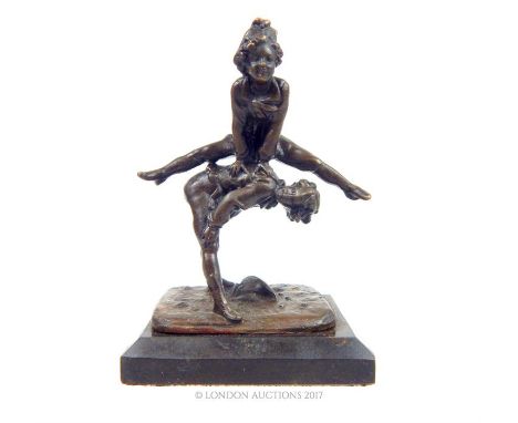 A bronze figural group of two acrobats, 13 x 9.5 x 7cm.
