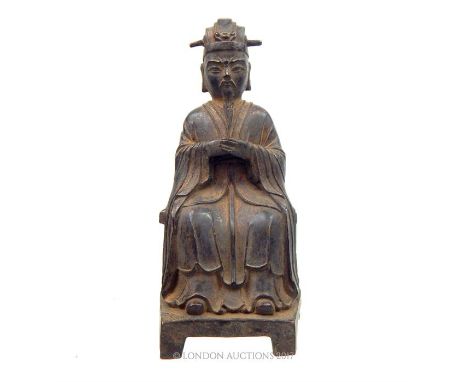 A Chinese bronze figure of a seated man, 22 x 10 x 9cm.