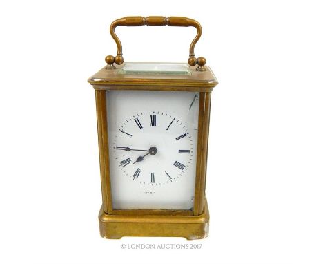 A 20th century gilt brass carriage clock, with four glass panels and visual platform escapement aperture ,the dial marked 'Lo