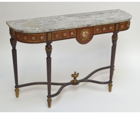 A French console table with marble top and inset porcelain plaques on circular reeded stretchered supports with gilt finial a