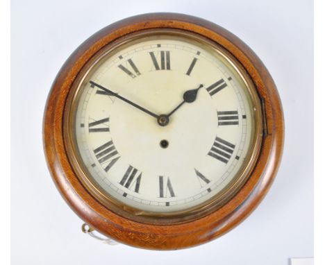 An early 20th century stained beech thirty hour wall clock, the circular enamel dial set with Roman numerals, diameter 36cm.