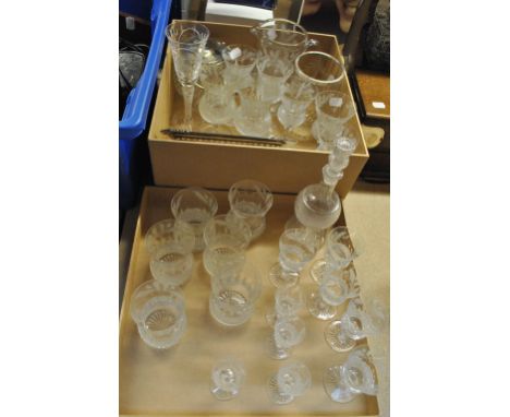 A set of Edinburgh clear glass thistle shaped drinking glasses including wine, tot and whisky, with a matching jug, all marke