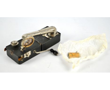 A Colibri miniature portable gramophone, 12 x 9 x 9cm.   CONDITION REPORT:  Postage within the UK would be approximately £21.