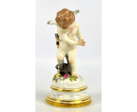 A Meissen porcelain figure of Cupid trapped in snares, on a floral mould decorated circular base and integral marble gilt hei