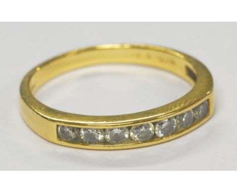 An 18ct yellow gold and diamond channel set half eternity ring totalling approx 0.50cts, size Q, approx 3.2g.