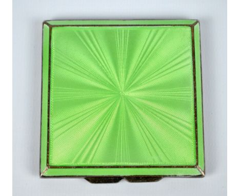 ADIE BROS LTD; a George V hallmarked silver and green guilloche enamel decorated overall engine turned decorated square powde