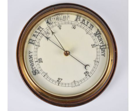 A 1920s oak circular wall barometer, diameter 25cm.