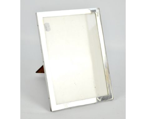 HASSET & HARPER LTD; a large George V hallmarked silver fronted rectangular photo frame, engraved with two Masonic emblems to