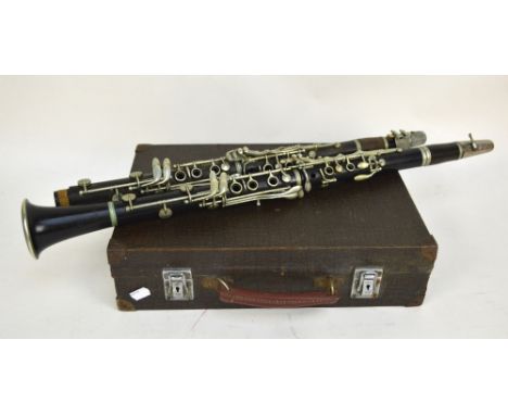 A French Ioma 'Selectone' ebonised clarinet, and a further Martin Dore of Paris resin example (part missing), in one case. 